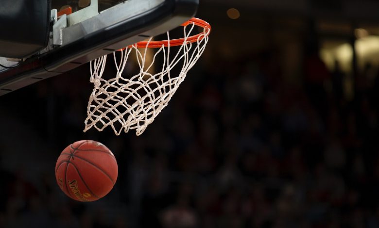 Image of a basketball going through a hoop